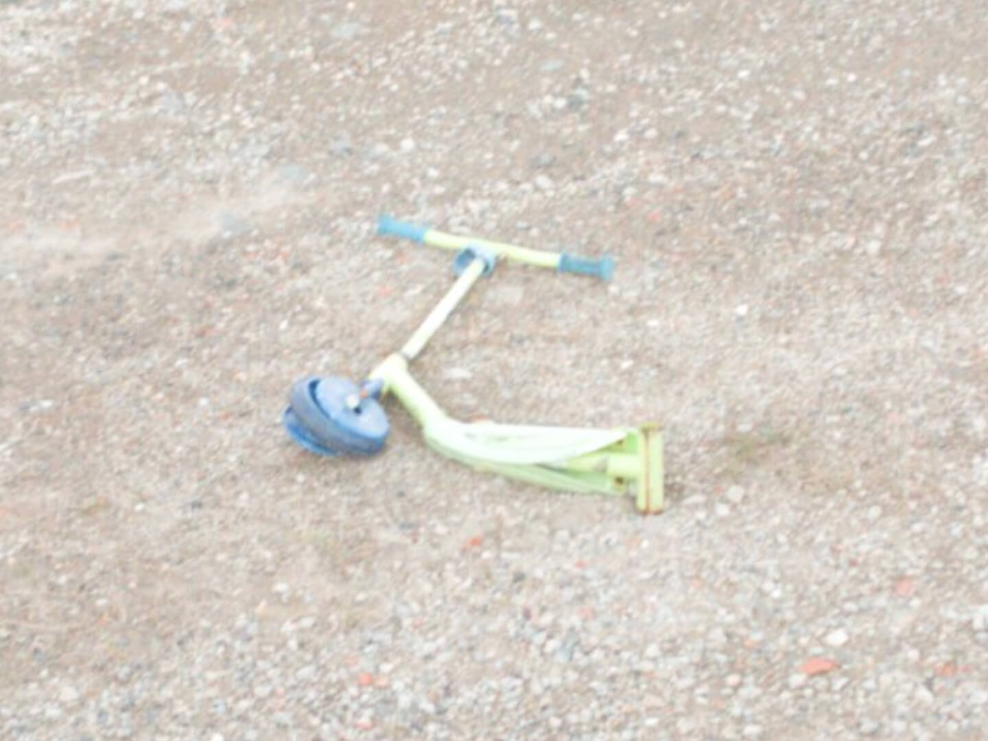 A lone, broken scooter belonging to a child at Cabramatta Station.